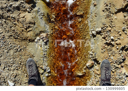 Acid mine water drainage flow, toxic mine waters polluting the environment 130999805