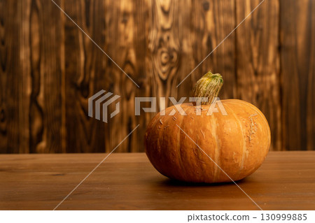 Autumn pumpkin on rustic wooden table background Autumn pumpkin on rustic wooden table background 130999885