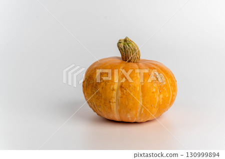 Orange autumn pumpkin on white background Orange autumn pumpkin on white background 130999894