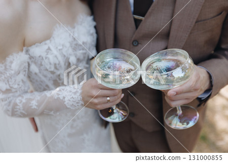 Newlyweds Toasting with Champagne 131000855