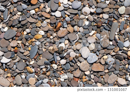Stone background. Pebble stones texture. Multi-colored stones background 131001087