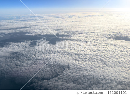 Aerial view white clouds in blue sky. Aerial top view cloudscape. Texture of clouds. View from above. Sunrise or sunset over clouds. Panorama sky Aerial view white clouds in blue sky. Aerial top view cloudscape. Texture of clouds. View from above. Sunrise or sunset over clouds. Panorama sky 131001101