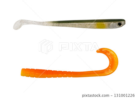Jig silicone fishing lure isolated on a white background. Silicone fishing baits isolated. Colorful baits. Fishing spinning bait. Silicone soft plastic bait lure Jig silicone fishing lure isolated on a white background. Silicone fishing baits isolated. Colorful baits. Fishing spinning bait. Silicone soft plastic bait lure 131001226