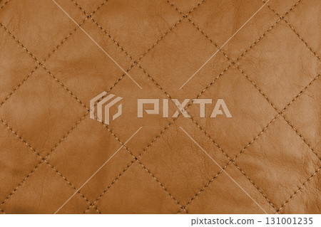 Leather texture background. Part of perforated brown leather details. Perforated leather texture background. Texture leather Leather texture background. Part of perforated brown leather details. Perforated leather texture background. Texture leather 131001235