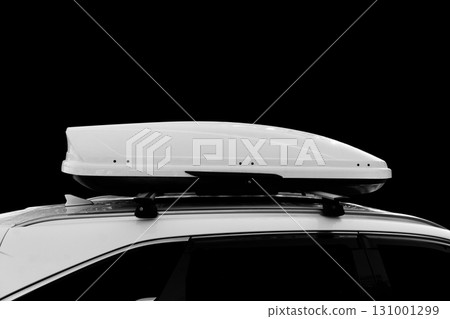 Carrier car roof box isolated. White plastic car rooftop cargo box or roof carrier for traveling. Removable storage container mounted on car roof rack. Carrier car roof box isolated. White plastic car rooftop cargo box or roof carrier for traveling. Removable storage container mounted on car roof rack. 131001299