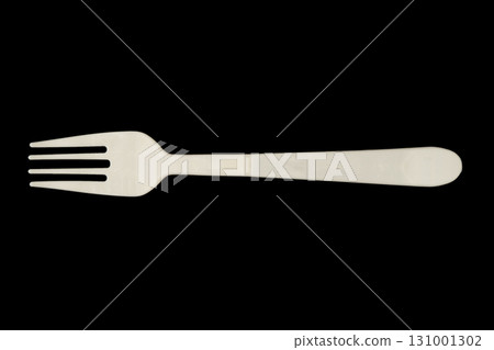 Black plastic fork isolated on black background. Disposable tableware set isolated Black plastic fork isolated on black background. Disposable tableware set isolated 131001302