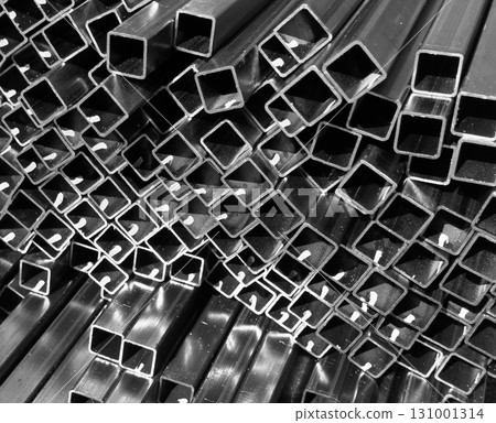 Steel profile manufacturing. Structural metal shapes. Metal profiles texture for constructions. Steel constructions factory background. Steel profile manufacturing. Structural metal shapes. Metal profiles texture for constructions. Steel constructions factory background. 131001314