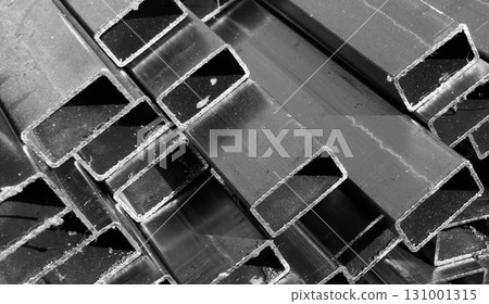Steel profile manufacturing. Structural metal shapes. Metal profiles texture for constructions. Steel constructions factory background. 131001315