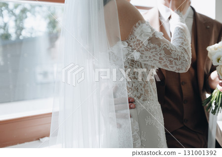 Gentle Wedding Embrace by Window Gentle Wedding Embrace by Window 131001392