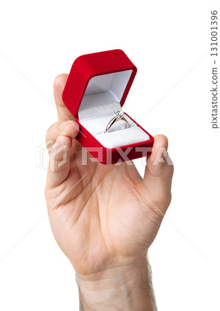 Hand holding open red ring box with sparkling diamond engagement ring, proposal concept isolated on transparent background Hand holding open red ring box with sparkling diamond engagement ring, proposal concept isolated on transparent background 131001396