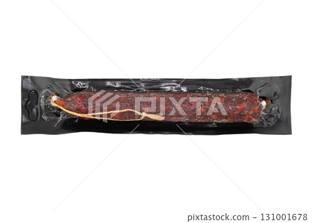 Top view of smoked meat salami in vacuum package isolated on black background. Raw smoked salami sausage isolated Top view of smoked meat salami in vacuum package isolated on black background. Raw smoked salami sausage isolated 131001678