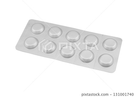 Macro shot pile of tablets pill in silver blister packaging isolated on white background. Aluminium foil blister pack. Pharmacy products. Medicine pills and drugs close up. Pills background 131001740
