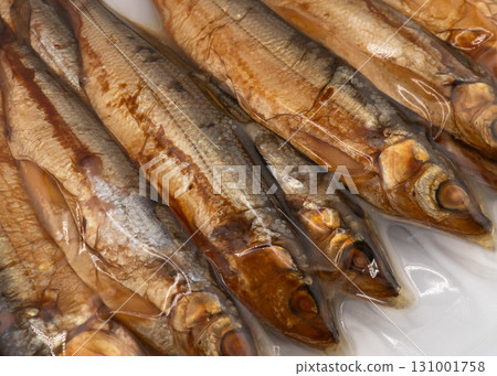 Vacuum packaged smoked fish texture background. 131001758