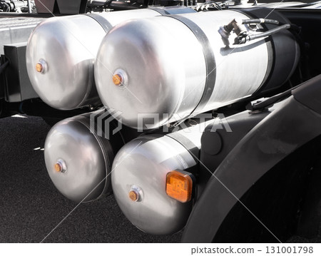 Air brake system of the truck. Black receivers with compressed air. Parts of a truck close-up. Heavy duty truck compressed air tanks. Air brake system of the truck 131001798