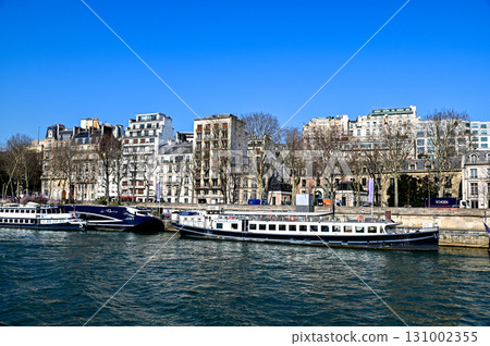Beautiful view of Paris from a Seine River cruise ship 131002355