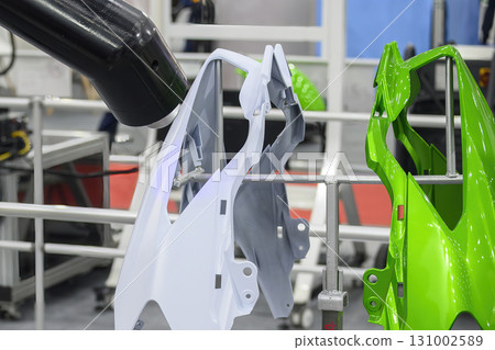 Close up scene the automatic painting robot working with automotive parts. 131002589