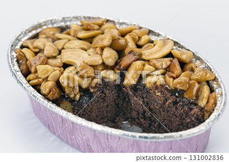 Caramel toffee cake nut chocolate dessert sweet baked snack delicious are combined in this rich chocolate cake topped with caramelized nuts creating decadent and inviting treat 131002836