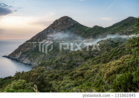 Coastline view Roadtrip Winding road along rocky coast of Cap Corse peninsula on Corsica island France 131002845