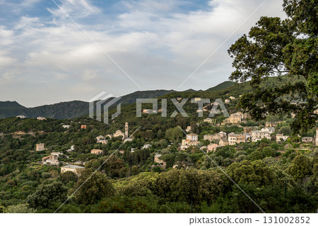 Village beach view Roadtrip Winding road along rocky coast of Cap Corse peninsula on Corsica island France 131002852