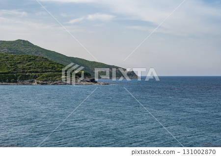 Village beach view Roadtrip Winding road along rocky coast of Cap Corse peninsula on Corsica island France Village beach view Roadtrip Winding road along rocky coast of Cap Corse peninsula on Corsica island France 131002870