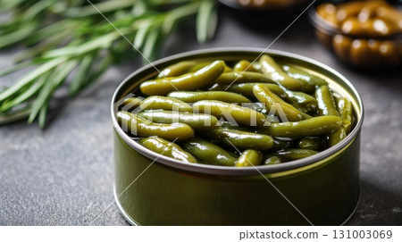 Canned green beans on a dark background. 131003069
