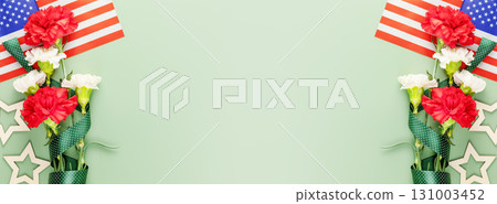 American holiday banner with bouquet of carnations and American flag on green background with copy space suitable for Memorial Day, 4th of July, Labour Day, Independence Day, Veterans day. Banner size 131003452