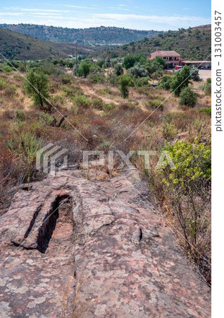 Ancient graves carved in rocks Carrasqueira necropolis Algarve Trail Portugal Ancient graves carved in rocks Carrasqueira necropolis Algarve Trail Portugal 131003457