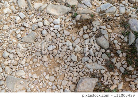 High angle view of ancient rocky hiking trail dirt path Via Algarviana High angle view of ancient rocky hiking trail dirt path Via Algarviana 131003459