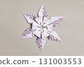 Money Origami snowflake with Euro bill on gray 131003553