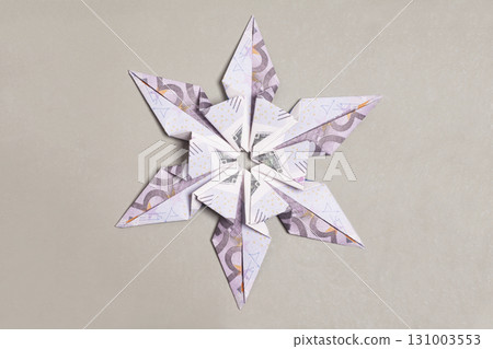Money Origami snowflake with Euro bill on gray 131003553
