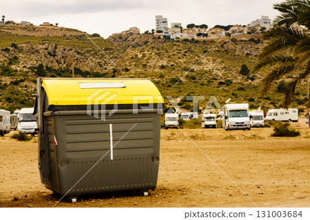 Garbage bin and campers on coast in Spain Garbage bin and campers on coast in Spain 131003684