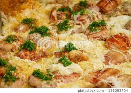 Many pork knuckle in big pot. 131003704