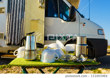 Clean dishes drying on fresh air, capming outdoor 131003968