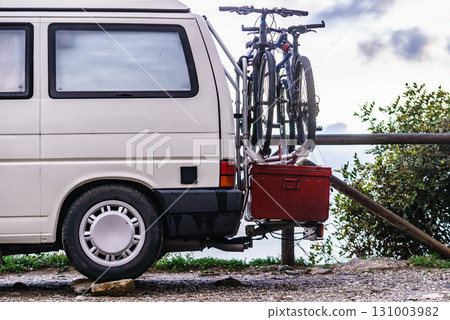 Van with box and bicycles on back 131003982