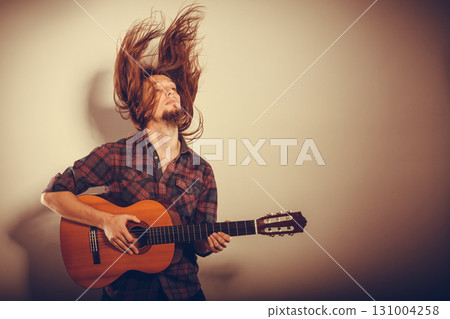 Enthusiast playing the instrument. 131004258
