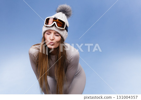woman in thermal underwear ski googles 131004357