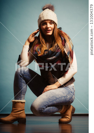 Fashionable girl in autumn warm clothing Fashionable girl in autumn warm clothing 131004379
