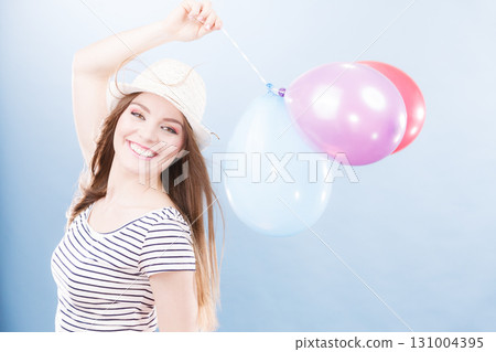 Woman summer joyful girl with colorful balloons Woman summer joyful girl with colorful balloons 131004395