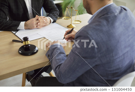 Lawyer working on office sighing a contract with a man client. Legal law and advice concept. 131004450