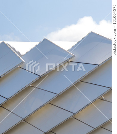 Conceptual shot of the textured wall of the modern facade of the building Conceptual shot of the textured wall of the modern facade of the building 131004573