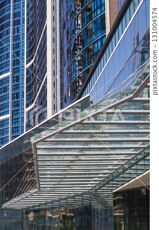 Conceptual shot of the textured wall of the modern facade of the building 131004574