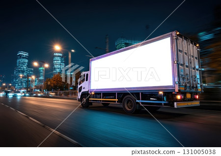 Clean White Billboard Displayed on Back of Truck Driving Through City at Night Clean White Billboard Displayed on Back of Truck Driving Through City at Night 131005038