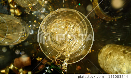 Freeze motion of pouring champagne into flute. Concept of celebration and success. Freeze motion of pouring champagne into flute. Concept of celebration and success. 131005244