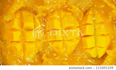 Freeze motion of falling fresh mango fruit into water Freeze motion of falling fresh mango fruit into water 131005289
