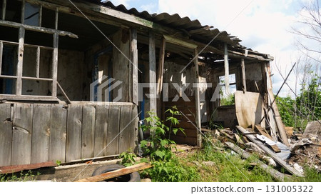 View to destroyed residential buildings at Kharkivska oblast. Ruined houses after bomb attacks on ukrainian territory from russia army. Consequences of russian invasion of Ukraine. Slow motion 131005322