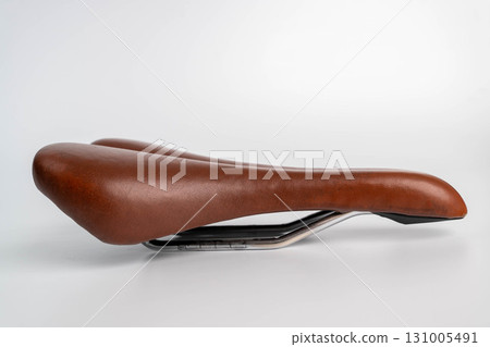 Brown leather bicycle saddle for comfortable cycling 131005491