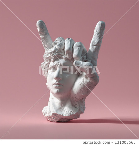 Realistic ancient white marble statue depicting a hand gesture in a soft pink background 131005563