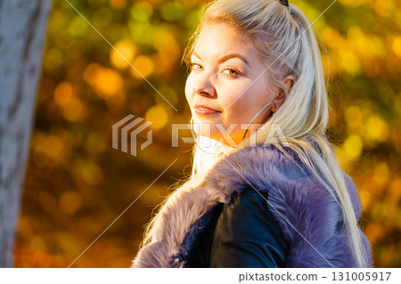 Fashion woman walking in autumn park Fashion woman walking in autumn park 131005917
