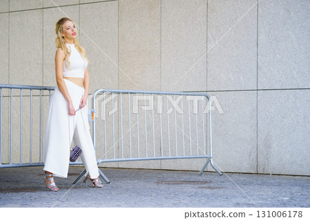 Woman wearing crop top and culottes Woman wearing crop top and culottes 131006178