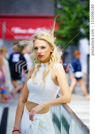 Woman wearing crop top and culottes Woman wearing crop top and culottes 131006180